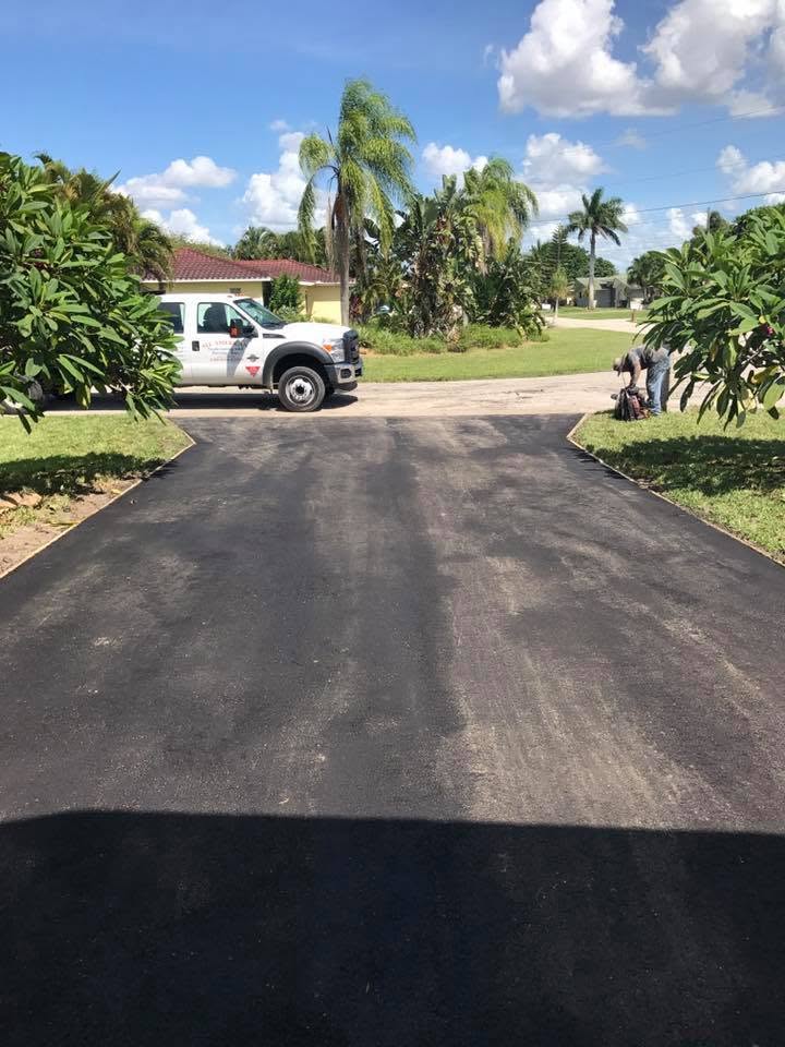 Freshly sealcoated residential driveway in Cape Coral, Florida