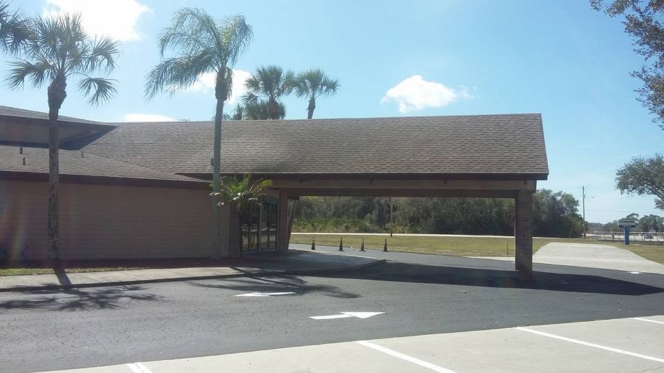 Church parking lot with fresh sealcoat and new white parking stall striping