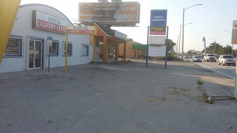 Worn out commercial parking lot before repaving in Fort Myers, Florida